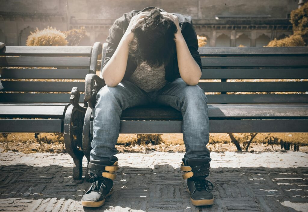 Man sitting alone, lonely, isolation, isolated, social anxiety,